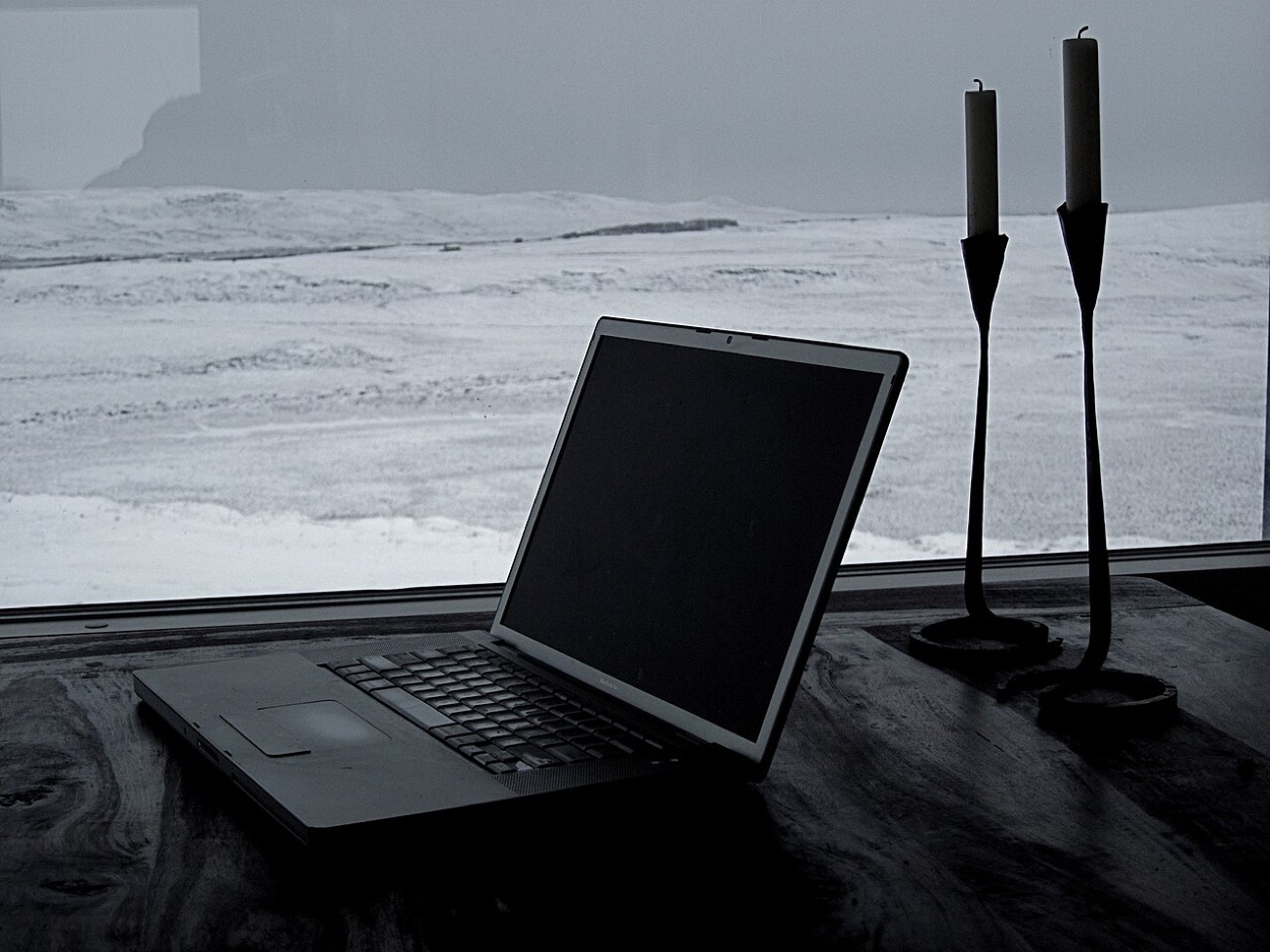 An open laptop on a desk, ready to write an email