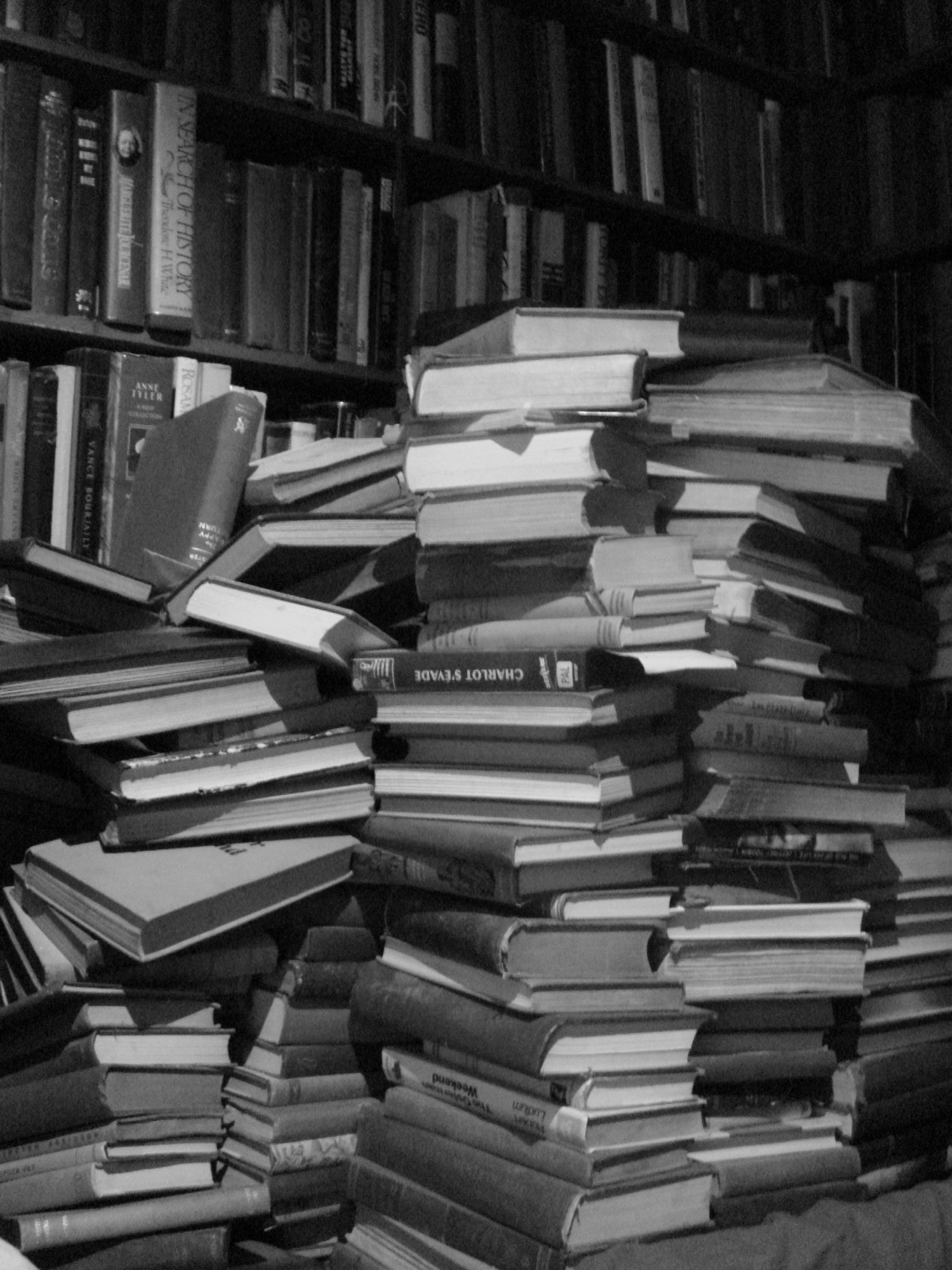 A stack of research books and journals